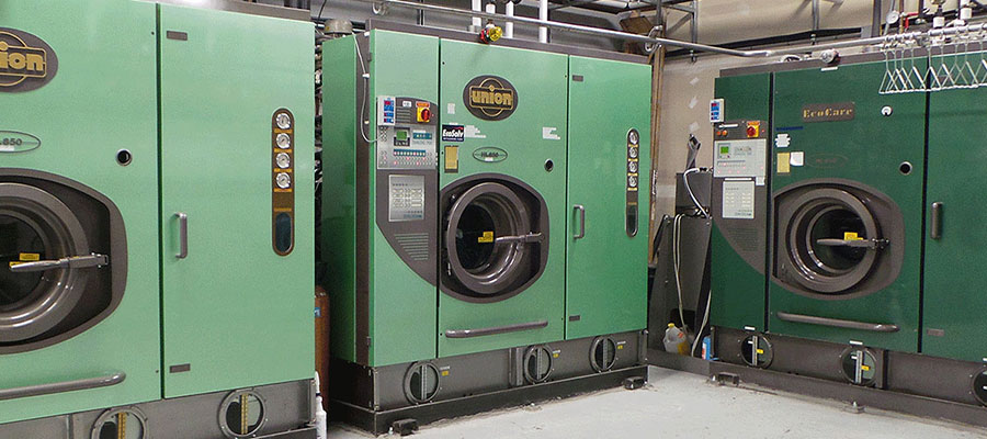 Green EcoSolv dry cleaning machines at the Eco Clean plant